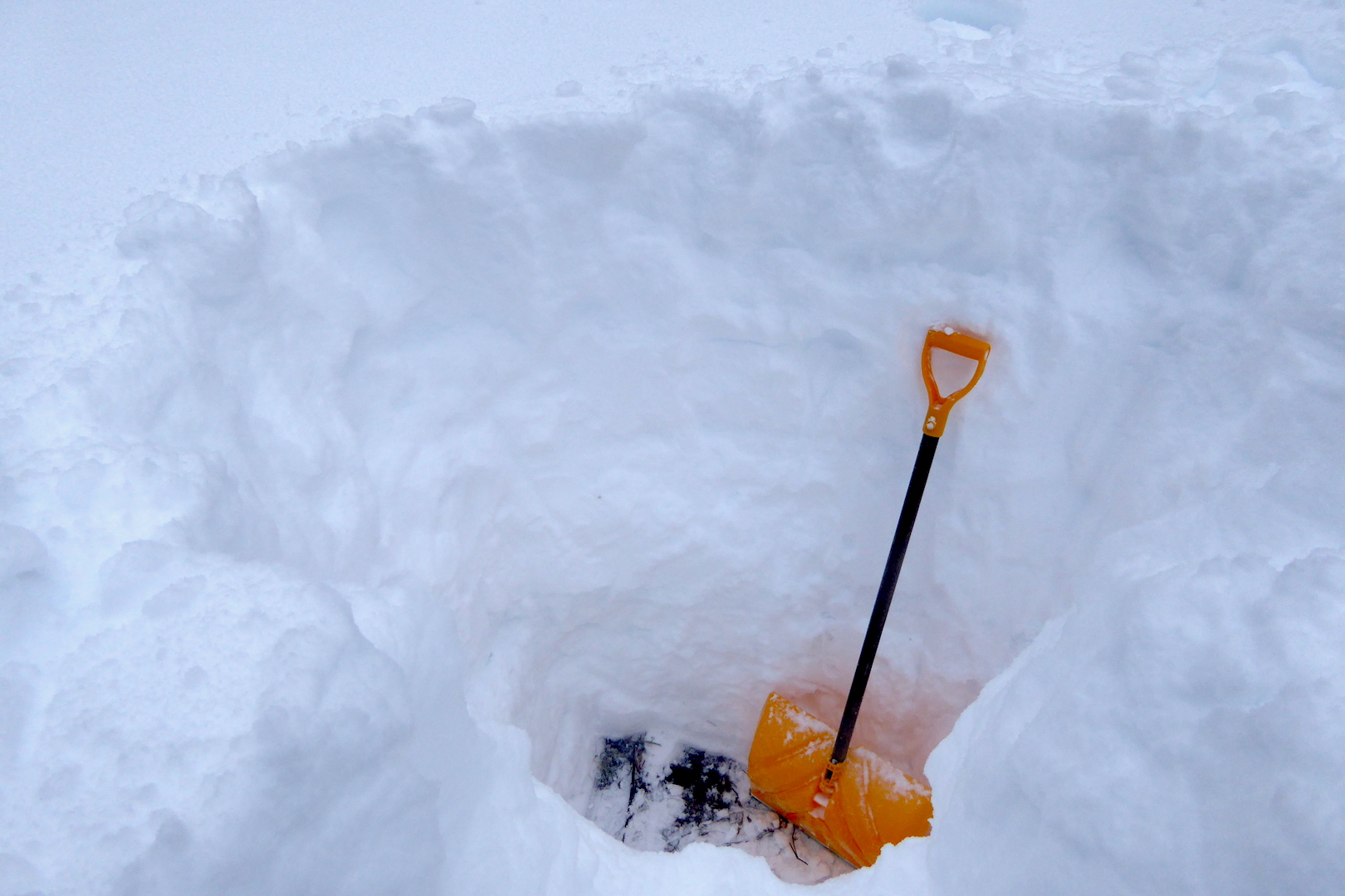 snow shovel in deep snow