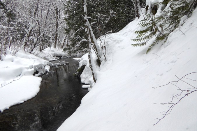 small open water channel next to steep slope