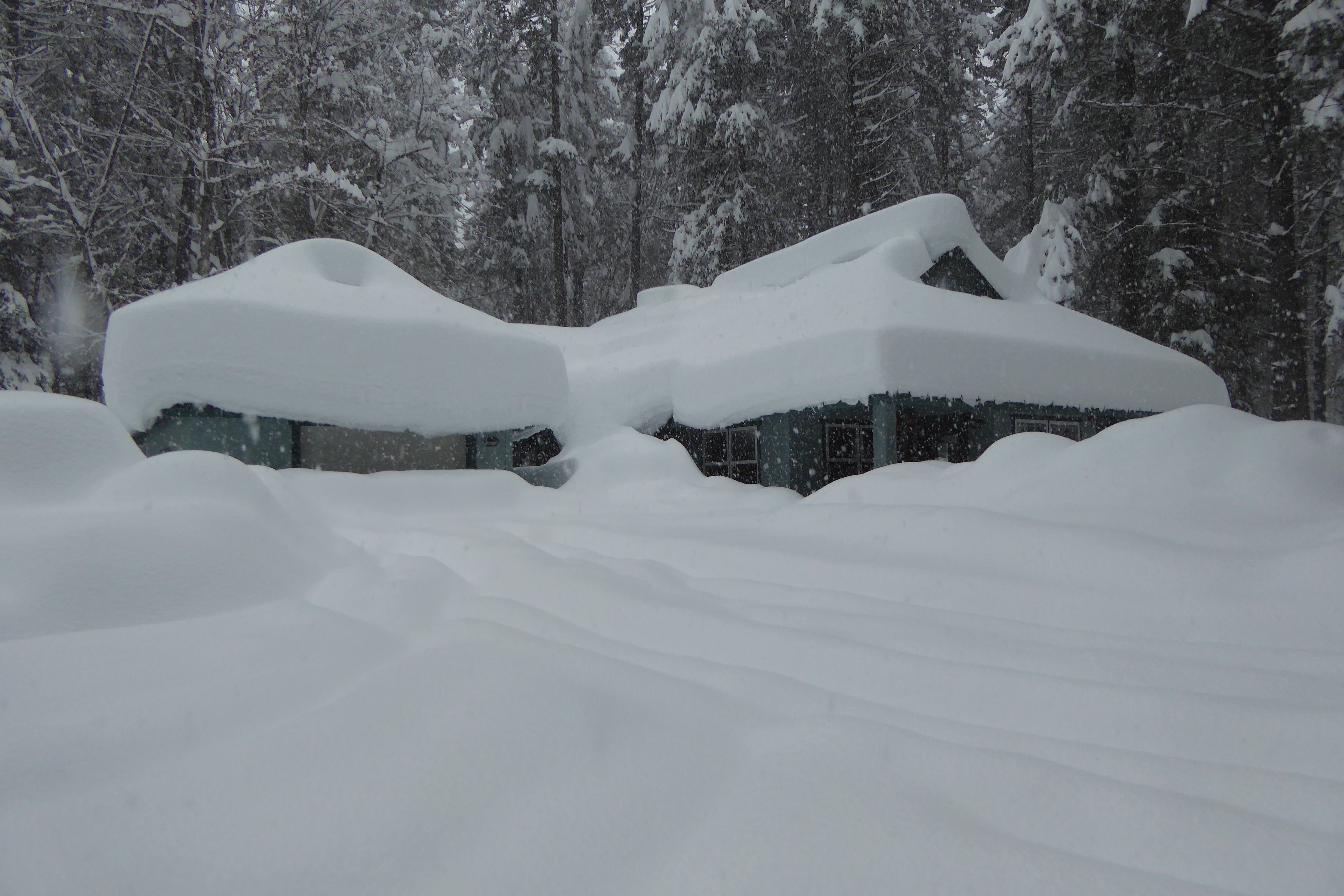 deep snow covering home