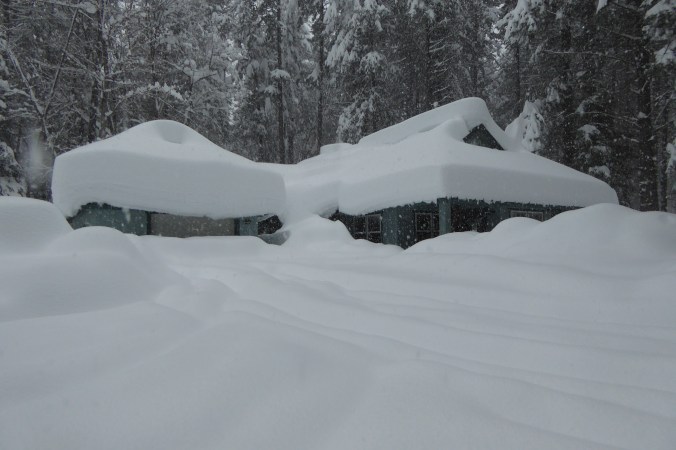 deep snow covering home