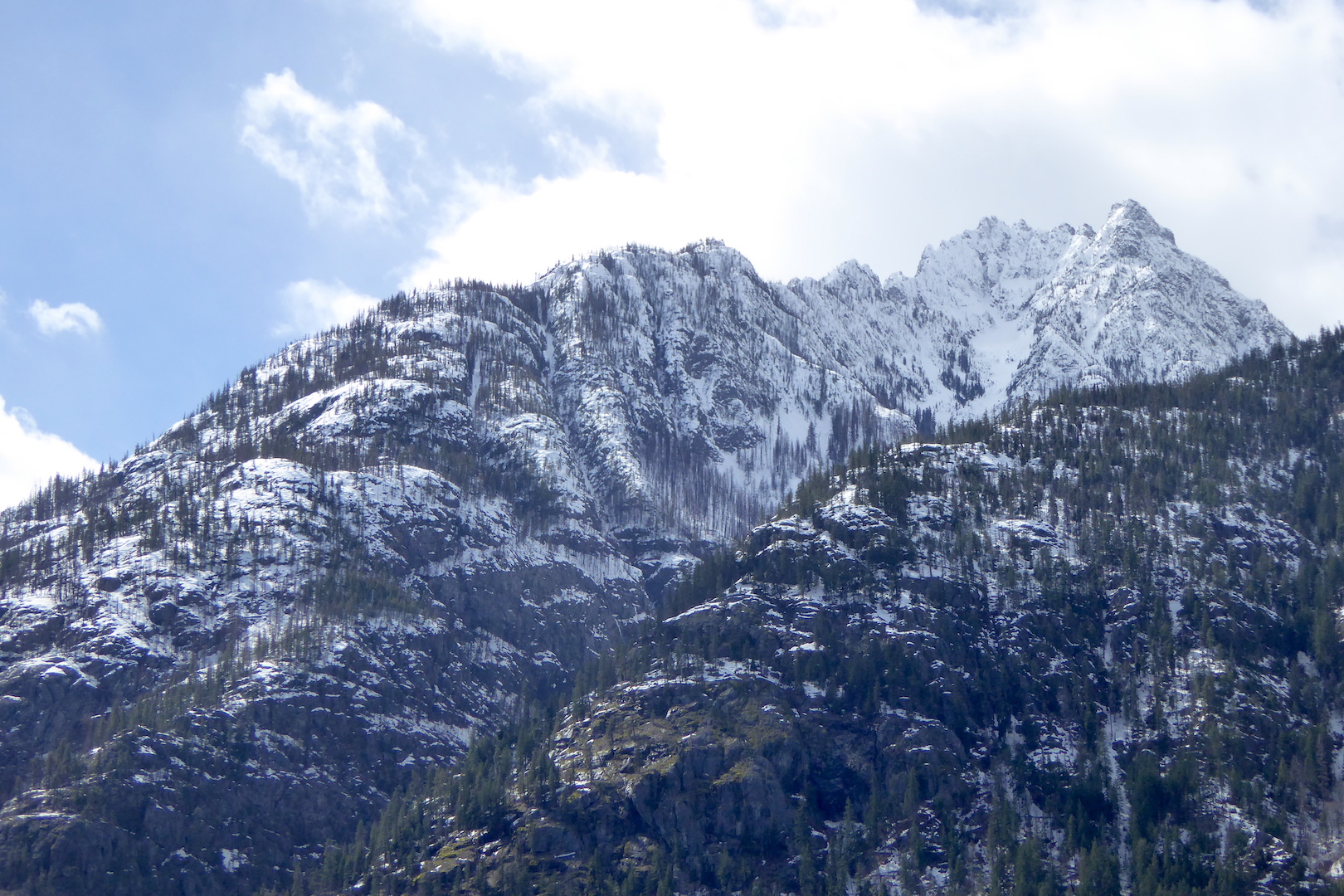 Snow covered mountain peak and ridgeline