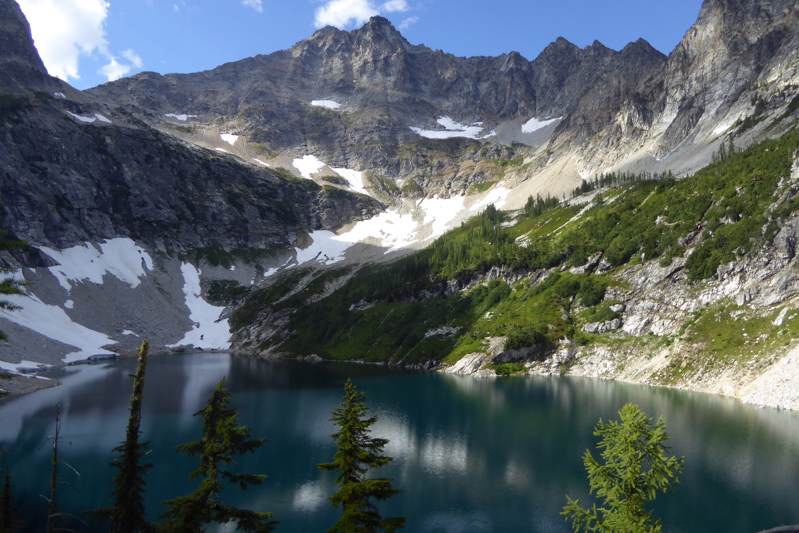 Bare mountain peak with lake below