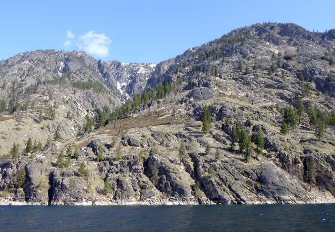 Steep mountain above lake
