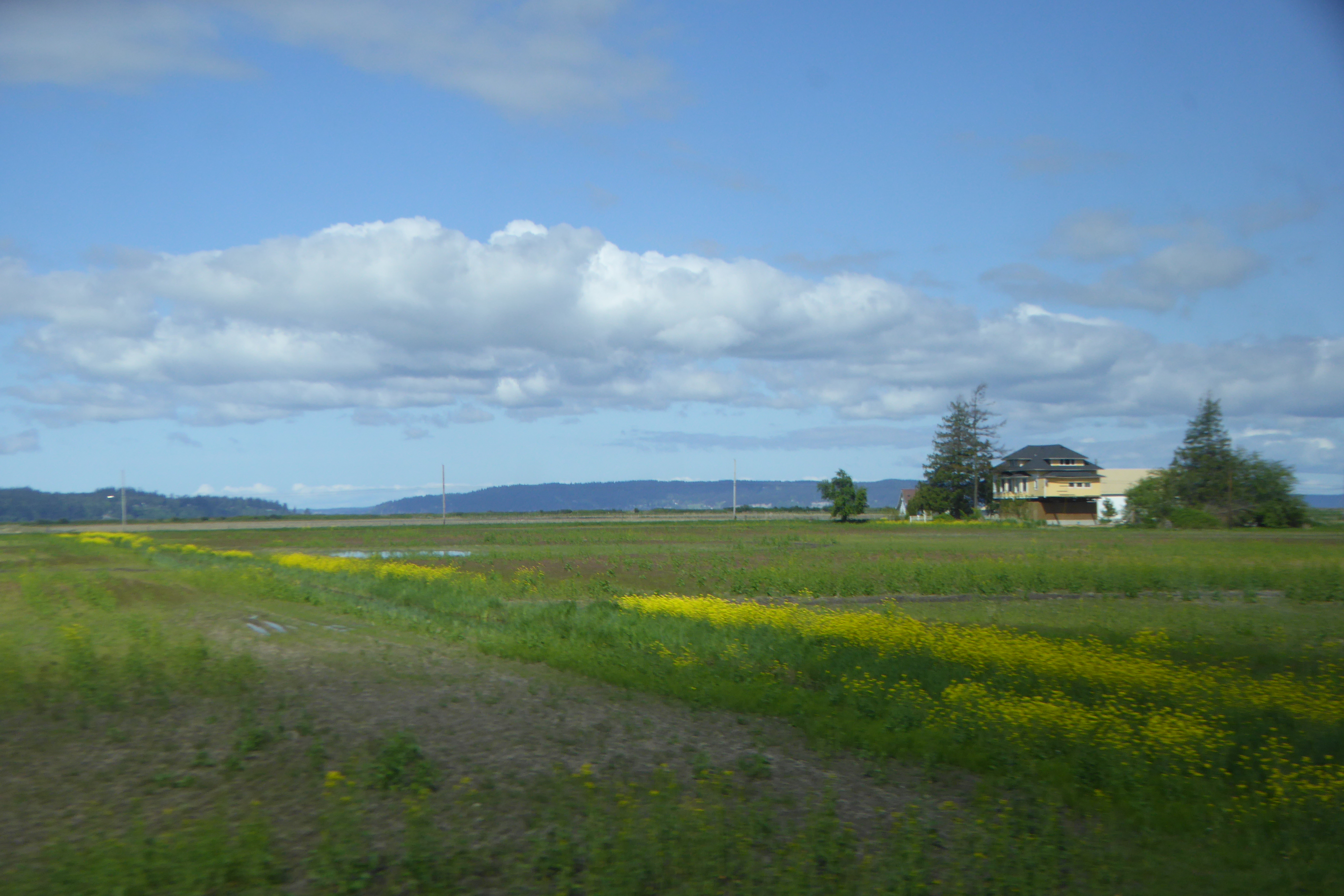 Fallow farm fields and farmhouse