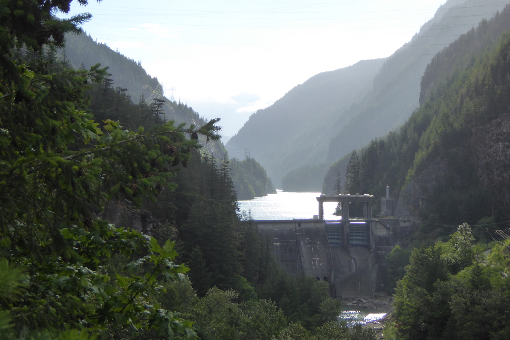 mountain valley with dam and lake