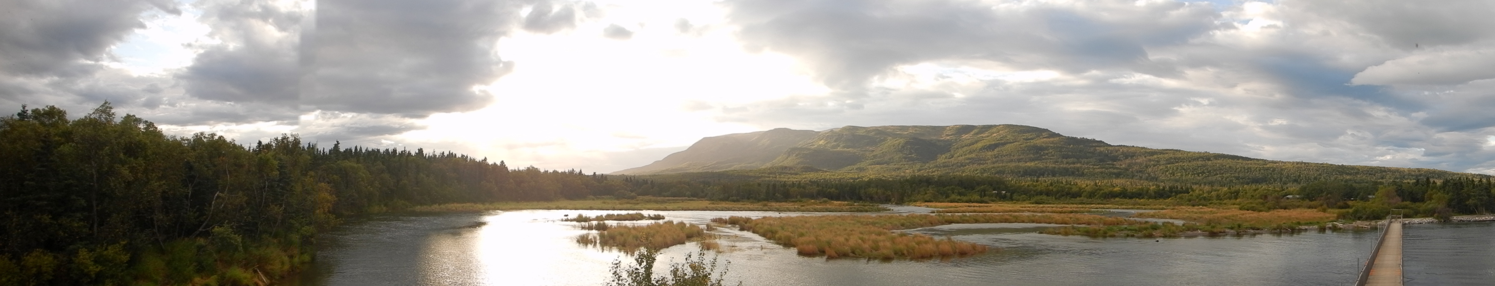panorama of river and mountain near sunset