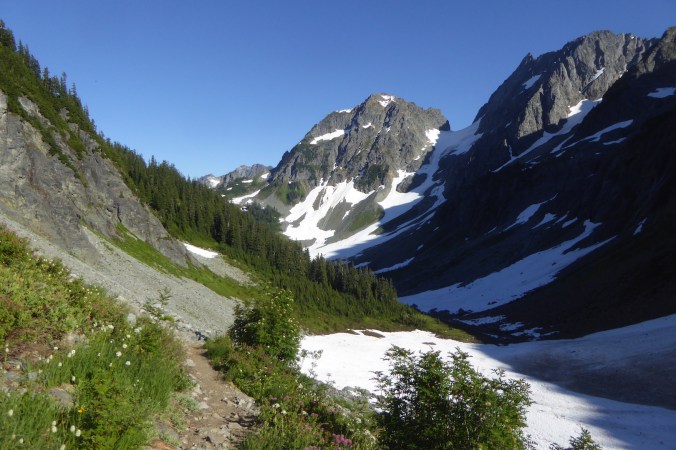 view of mountain scenery with craggy peaks and snowfields.