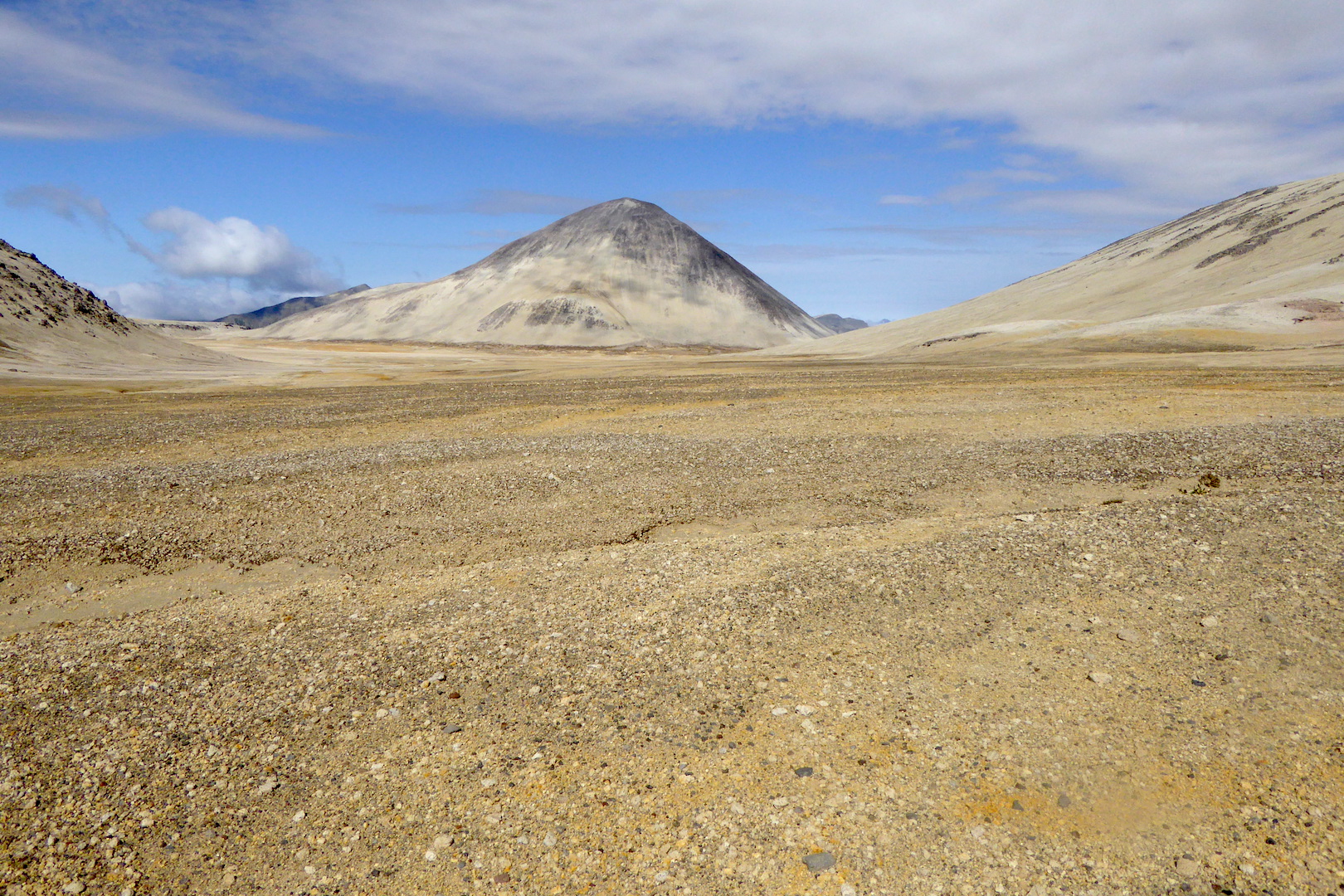 ash and pumice covered plain with hills
