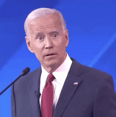 GIF of Joe Biden at podium looking surprised.